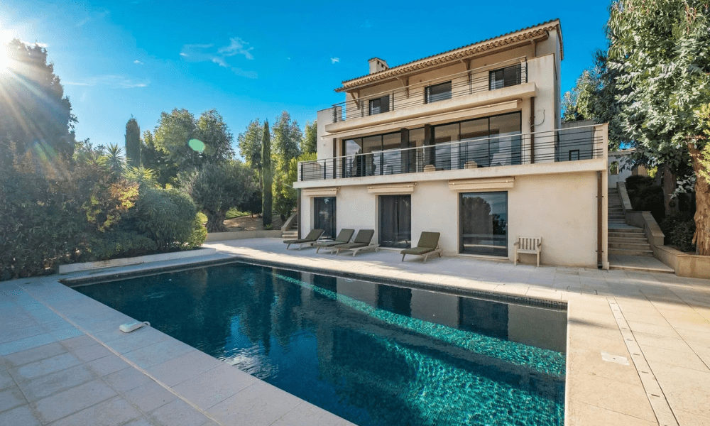 Poolside sun loungers beside crystal-clear infinity-edge water